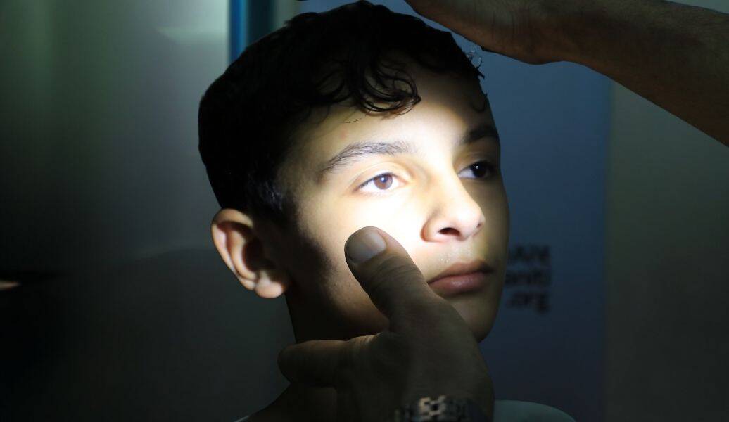 A young boy receiving an eye exam